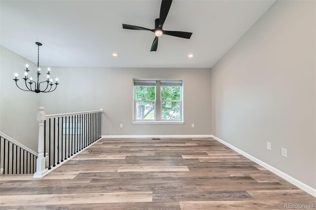 6040 W 75th Dr, Arvada, CO 80003 - empty room featuring ceiling fan, a chandelier, wood finished floors, and recessed lighting