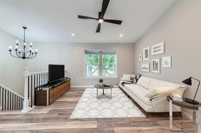6040 W 75th Dr, Arvada, CO 80003 - living room with ceiling fan, wood finished floors, a chandelier, and recessed lighting