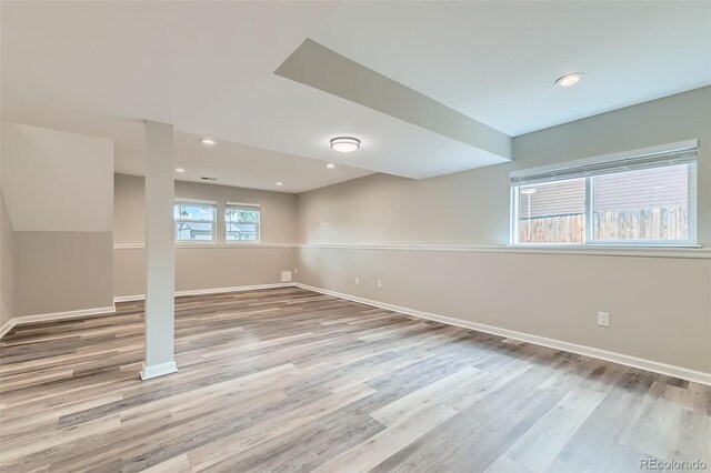 6040 W 75th Dr, Arvada, CO 80003 - below grade area featuring wood finished floors and recessed lighting