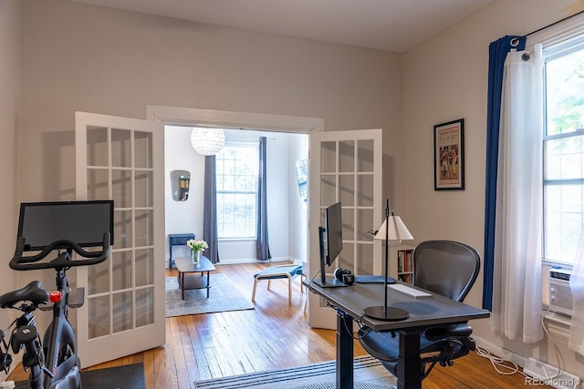 office area featuring french doors, baseboards, and wood-type flooring