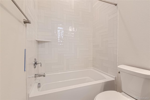 bathroom featuring bathing tub / shower combination and toilet