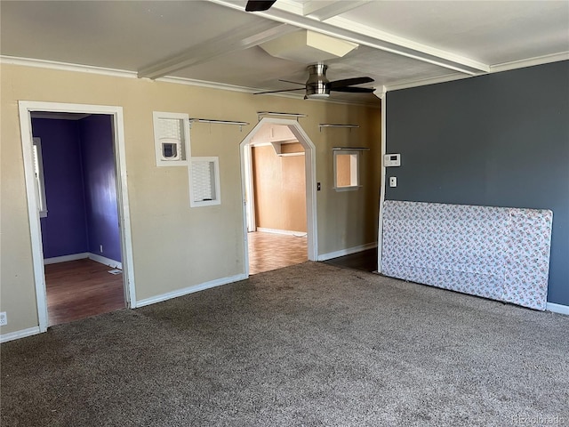 carpeted empty room with ceiling fan and ornamental molding