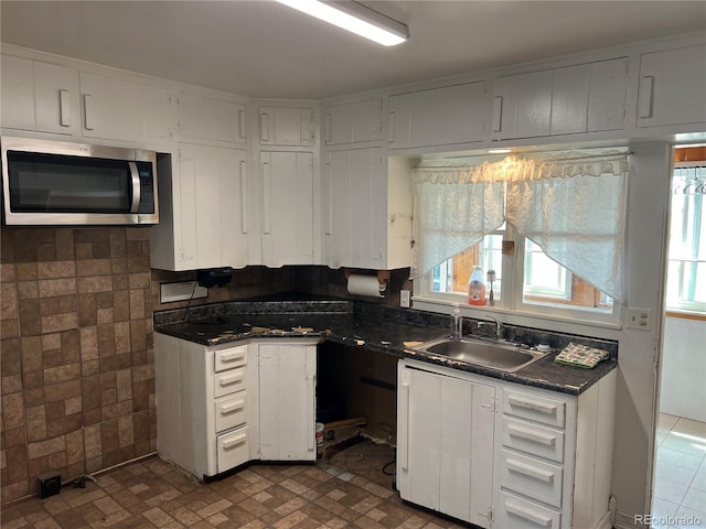 kitchen with sink and white cabinets