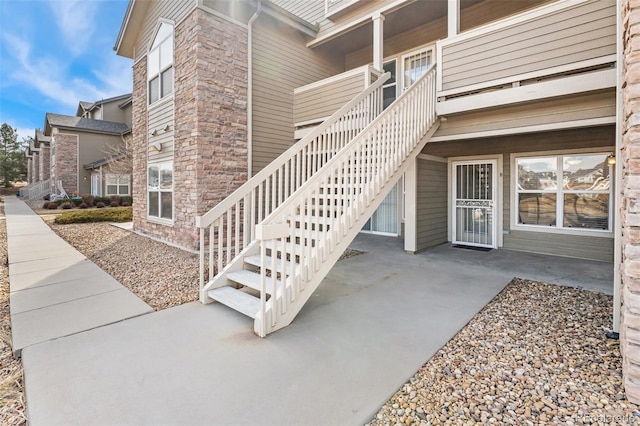 doorway to property with a patio