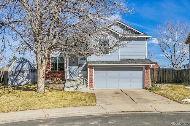 traditional home with a garage, concrete driveway, fence, a front lawn, and brick siding