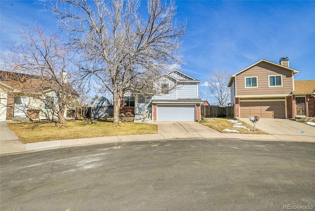 view of front of home with driveway, brick siding, and an attached garage