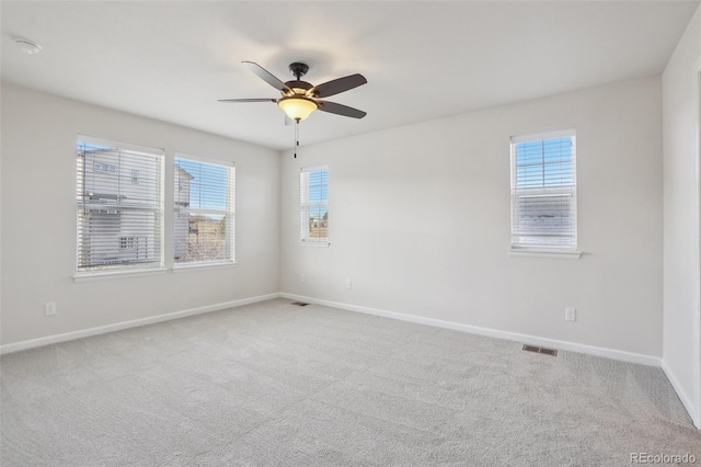 carpeted empty room with ceiling fan