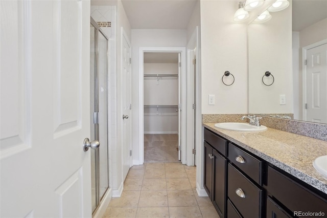 bathroom featuring vanity, tile patterned floors, and an enclosed shower