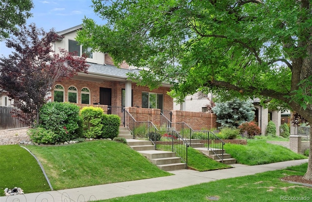 538 Cook St, Denver, CO 80206 - obstructed view of property with brick siding