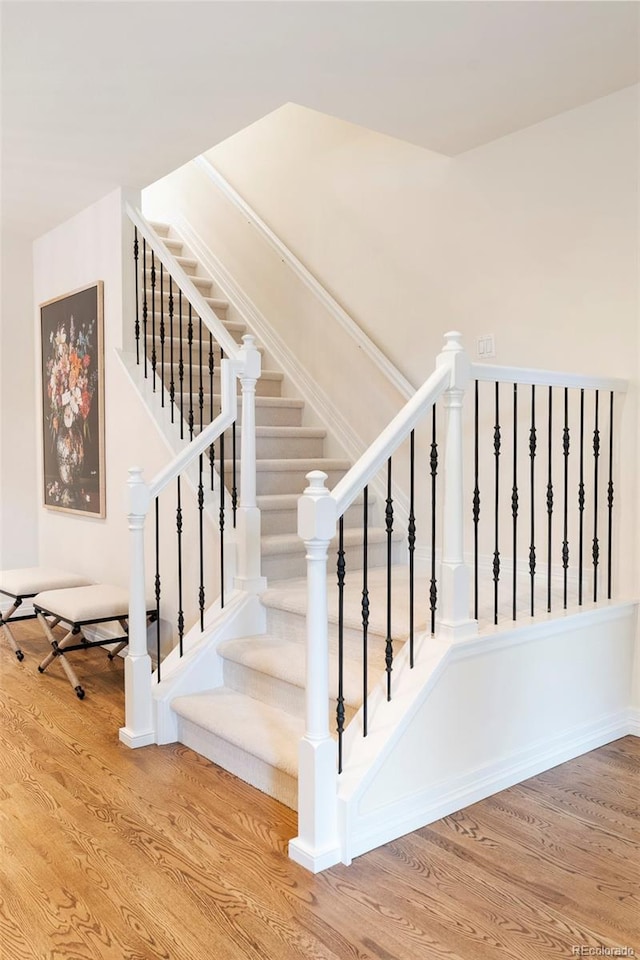 538 Cook St, Denver, CO 80206 - staircase featuring wood finished floors