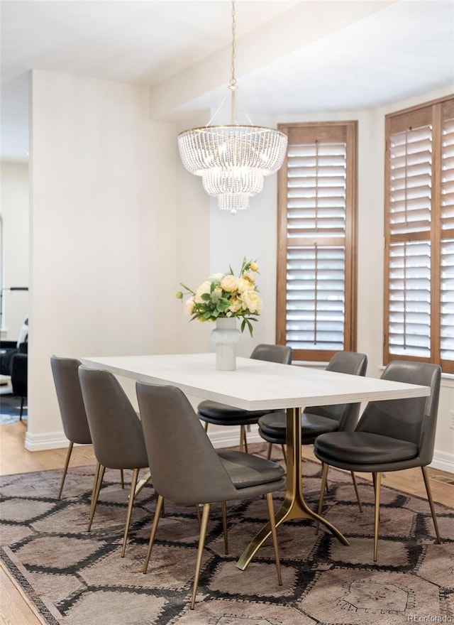 538 Cook St, Denver, CO 80206 - dining room with a chandelier and light wood finished floors