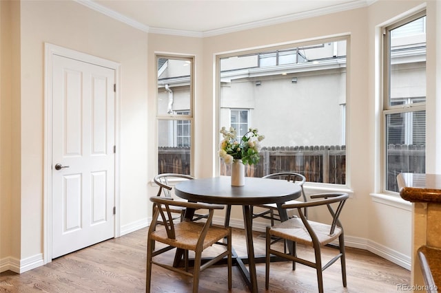 538 Cook St, Denver, CO 80206 - dining area featuring crown molding and light wood-style flooring