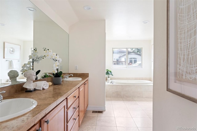 538 Cook St, Denver, CO 80206 - bathroom featuring a bath, double vanity, and tile patterned floors