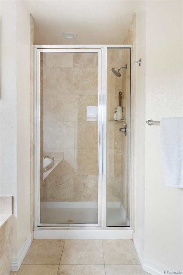 538 Cook St, Denver, CO 80206 - full bathroom with a stall shower and tile patterned flooring