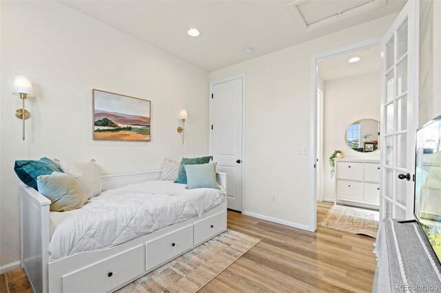 21 N Edge Cliff St, Castle Rock, CO 80104 - bedroom featuring attic access, wood finished floors, recessed lighting, and baseboards