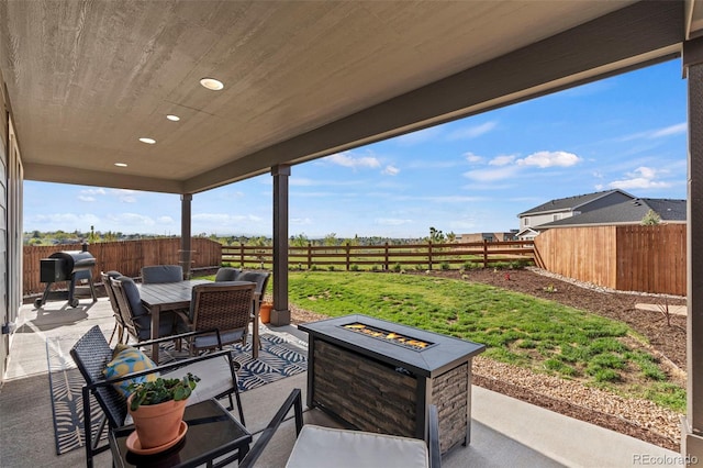 21 N Edge Cliff St, Castle Rock, CO 80104 - view of patio / terrace with a fire pit, outdoor dining space, and area for grilling
