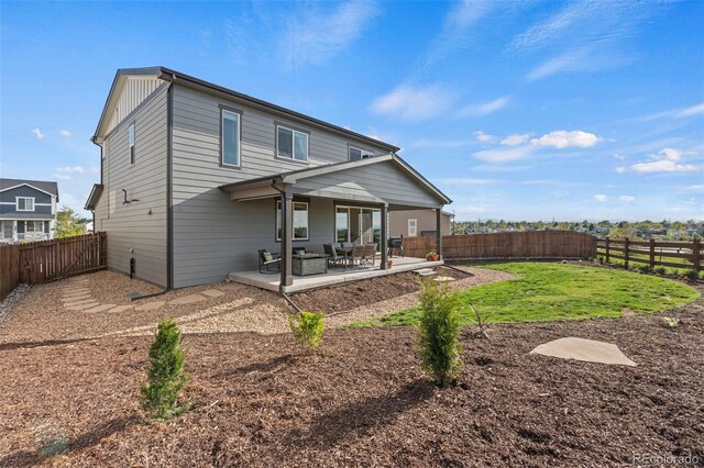 21 N Edge Cliff St, Castle Rock, CO 80104 - rear view of house featuring a fenced backyard and a patio area