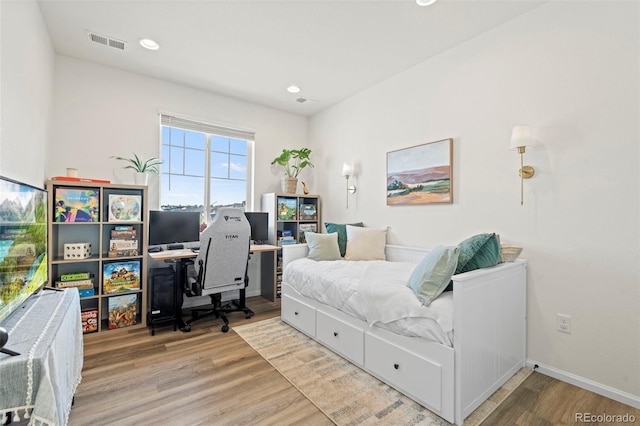 21 N Edge Cliff St, Castle Rock, CO 80104 - bedroom with wood finished floors, an office area, and recessed lighting