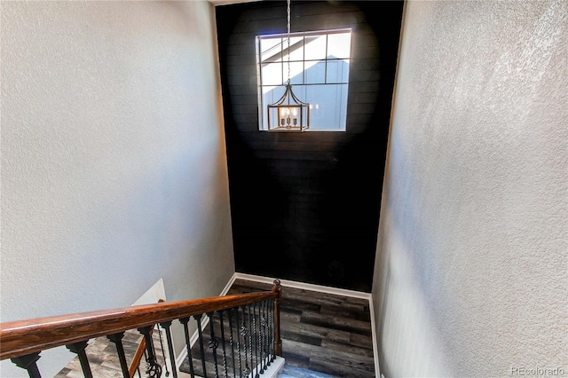 staircase with wood-type flooring