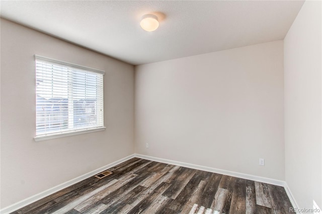 empty room featuring dark hardwood / wood-style floors