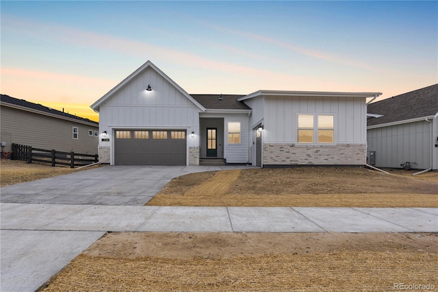 7392 Timberstone St, Castle Pines, CO 80108 - modern inspired farmhouse featuring board and batten siding, an attached garage, concrete driveway, and brick siding