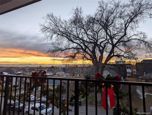 view of balcony at dusk