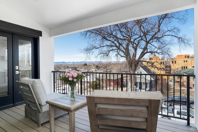 wooden terrace with a residential view and a mountain view