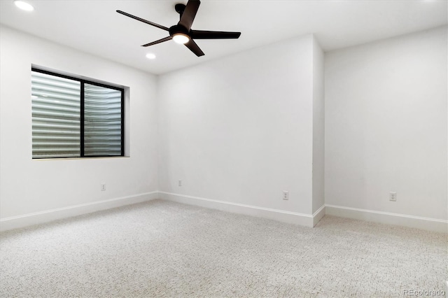 empty room with baseboards, ceiling fan, carpet flooring, and recessed lighting