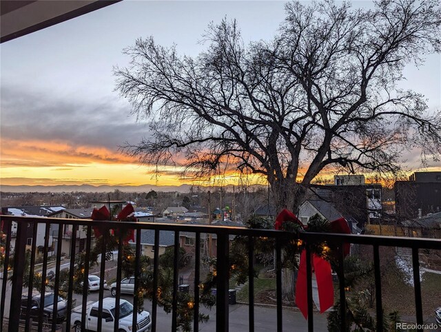view of balcony at dusk