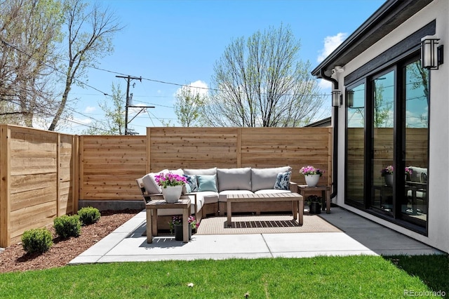 view of patio / terrace featuring a fenced backyard and an outdoor living space