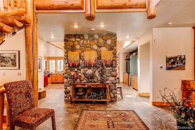 living room with beam ceiling and a textured ceiling