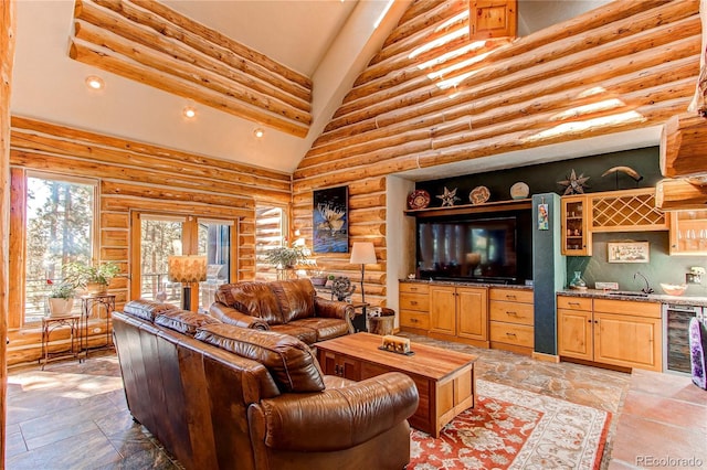 living room with beverage cooler, log walls, beam ceiling, indoor bar, and high vaulted ceiling