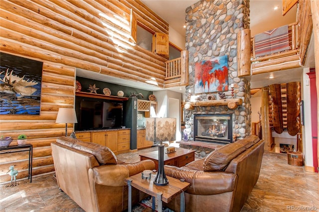 living room featuring a stone fireplace, a towering ceiling, and log walls