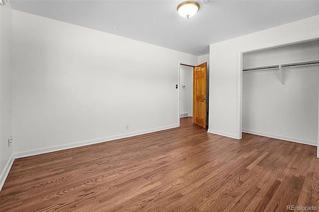 920 Emerson Cir, Northglenn, CO 80233 - unfurnished bedroom with wood finished floors and a closet