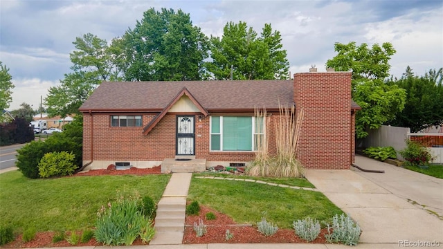 920 Emerson Cir, Northglenn, CO 80233 - view of front of property featuring brick siding, a chimney, and a shingled roof