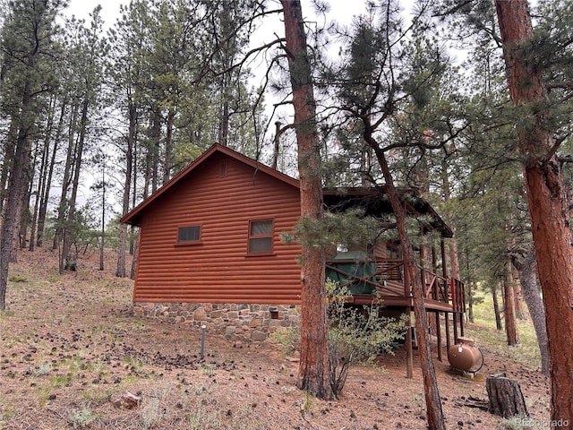 861 Happy Top Trl, Bailey, CO 80421 - view of home's exterior featuring faux log siding and a wooden deck