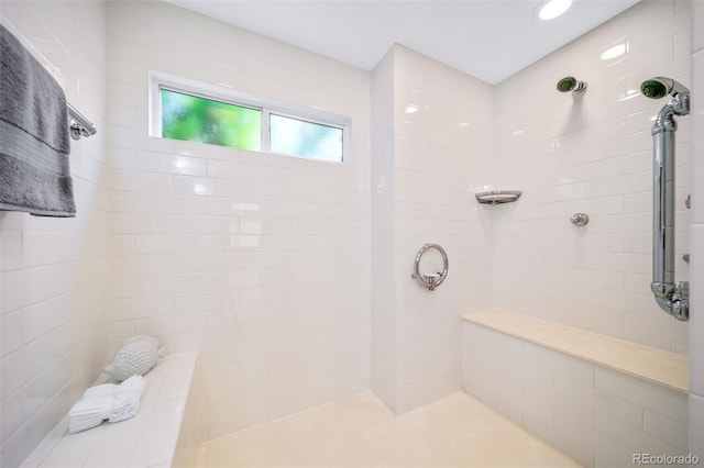 bathroom featuring tiled shower