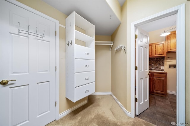 spacious closet with carpet floors