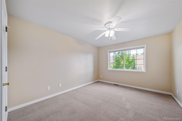 carpeted empty room with ceiling fan