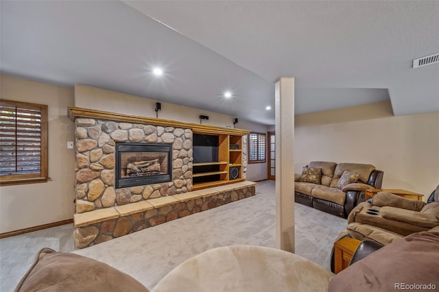 carpeted living room with a fireplace