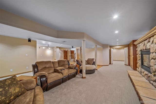 living room featuring light carpet and a fireplace