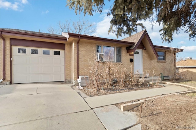 ranch-style home featuring a garage