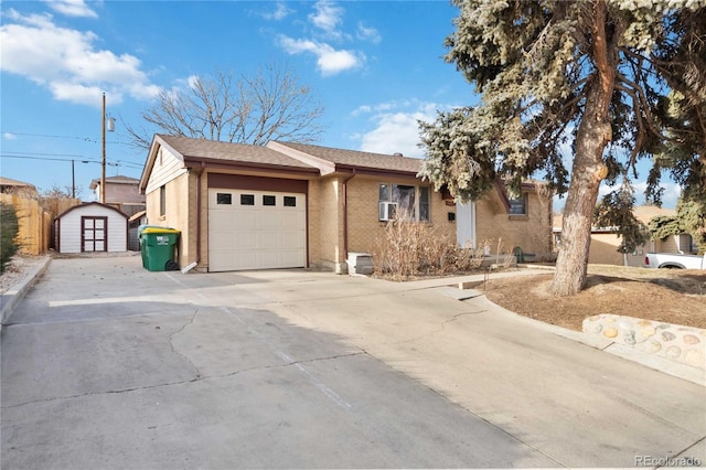 view of front facade featuring a shed and a garage