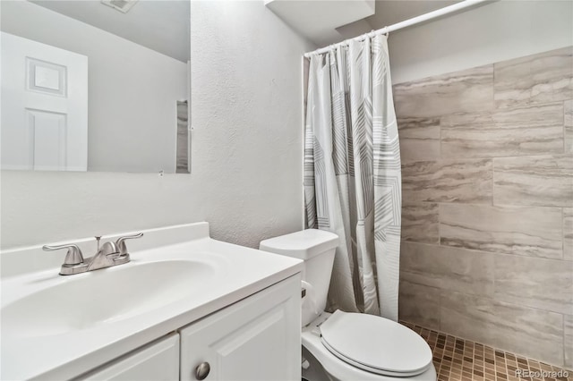 bathroom with vanity, toilet, and a shower with curtain