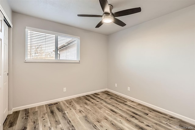 unfurnished room featuring ceiling fan and light hardwood / wood-style flooring