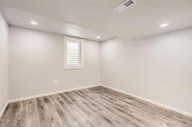 spare room featuring light hardwood / wood-style flooring