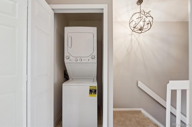 3078 W 107th Pl Unit D, Westminster, CO 80031 - washroom with stacked washer / drying machine, carpet floors, and a chandelier