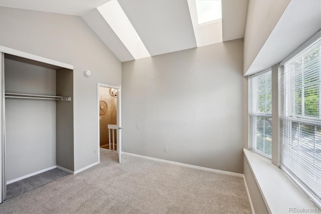 3078 W 107th Pl Unit D, Westminster, CO 80031 - unfurnished bedroom with carpet, a skylight, high vaulted ceiling, and a closet