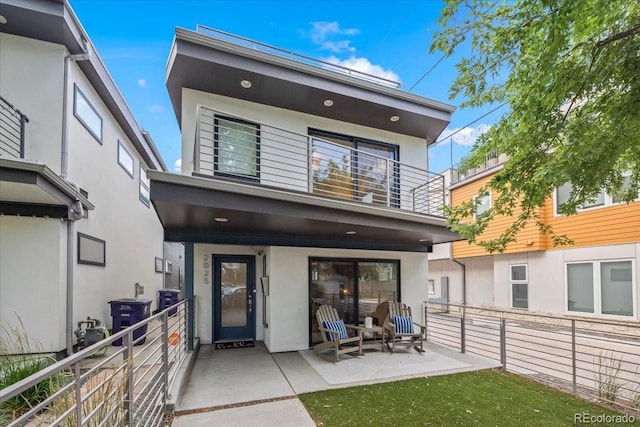 back of house with a patio and central air condition unit