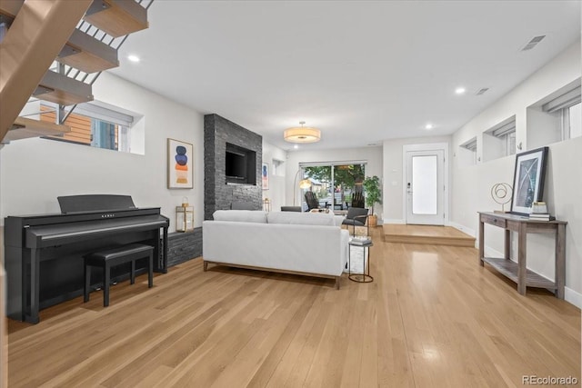 living room with light hardwood / wood-style flooring